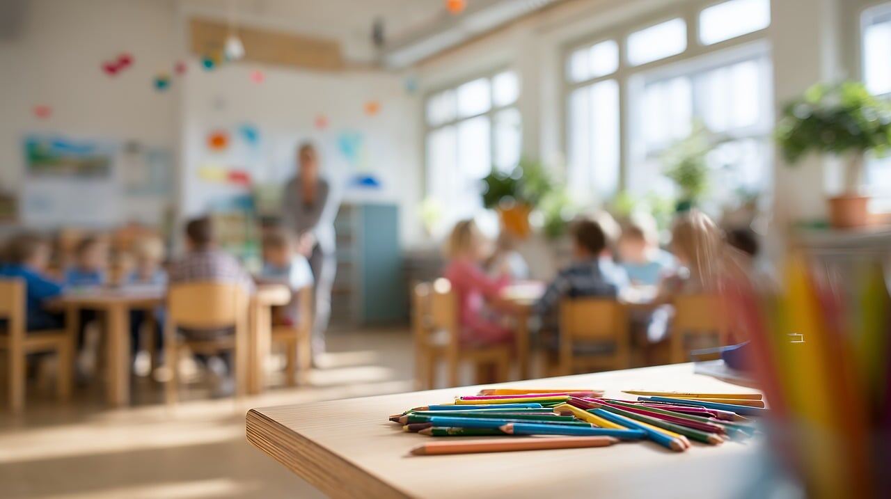 A teacher helping students in a special education classroom